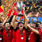 Équipe belge célébrant le titre européen avec enthousiasme.